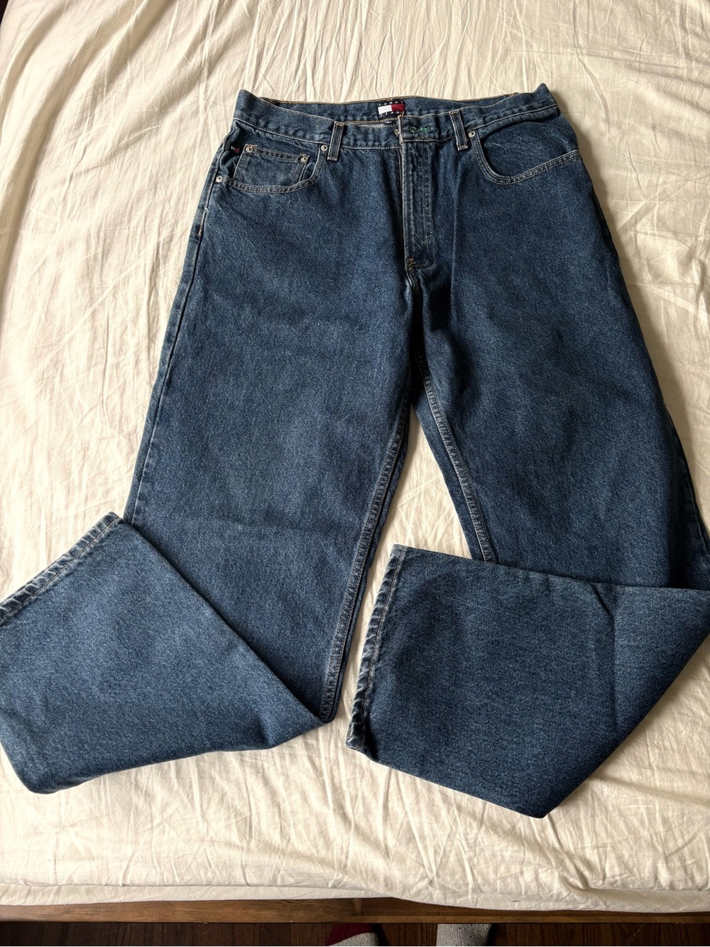 Vintage Tommy Jeans by Tommy Hilfiger men’s blue denim jeans.